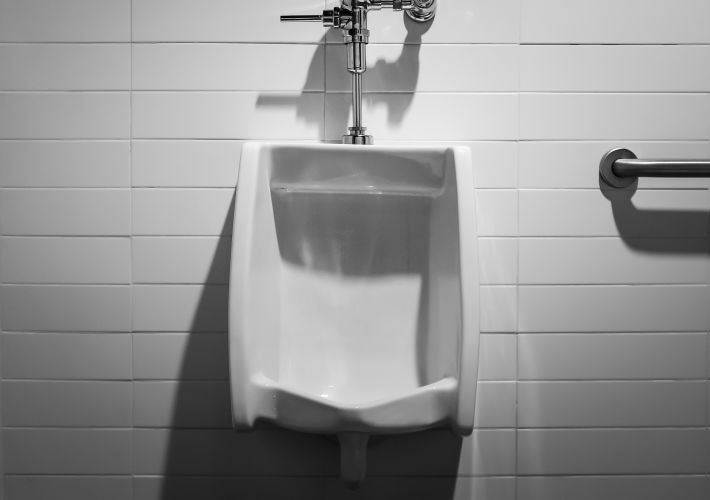 Professional and deep cleaning of a commercial public restroom and urinal.