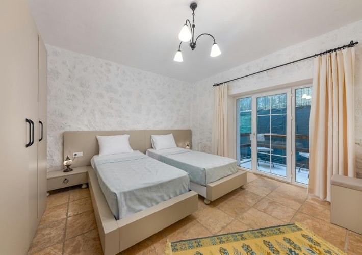 A professionally cleaned bedroom with two neatly made beds, ready for a restful night.